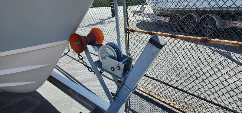 Slide: The Image of 2023 Grady-White Freedom 235 boat trailer hitch with winch and rollers. - 30