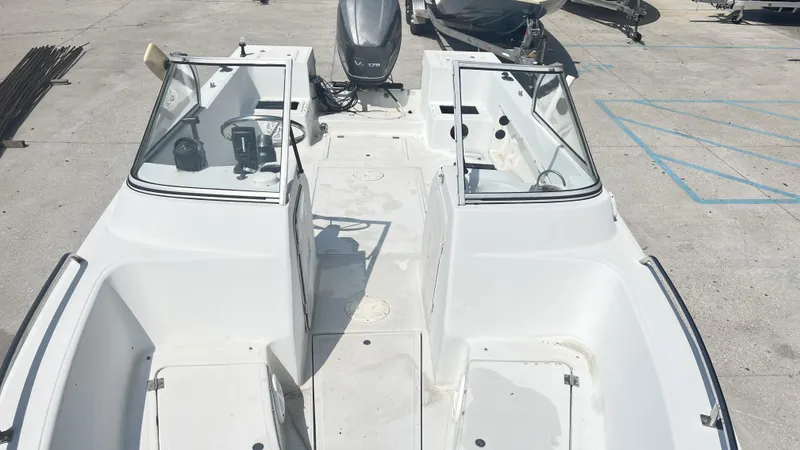 Slide: The Image of 1998 Pro Sports Walk Through boat on trailer, parked outdoors under clear sky. - 10