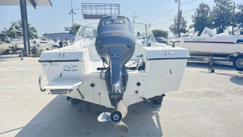 Slide: The Image of 1998 Pro Sports Walk Through boat on trailer with Yamaha motor, labeled "Anonymous." - 4