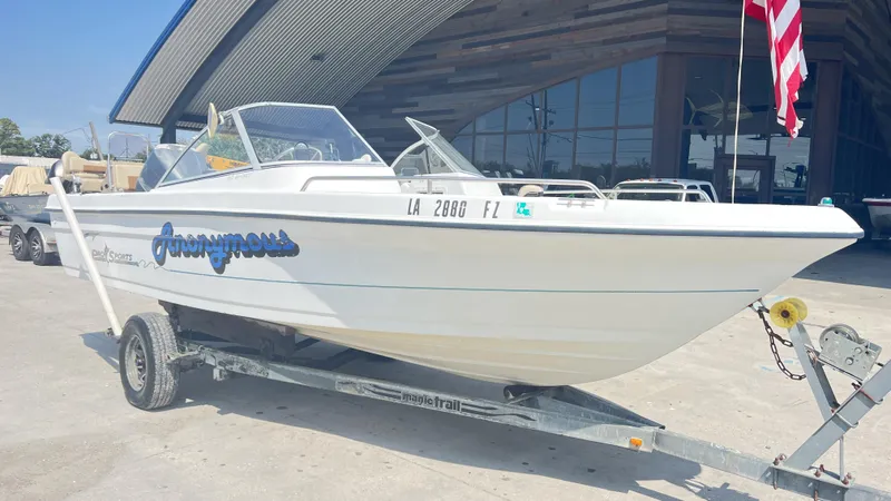 Slide: The Image of 1998 Pro Sports Walk Through boat interior with open deck and seating area. - 8