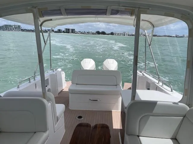 Slide: The Image of 2023 MJM 35z boat interior with seating, cruising on open water. - 14