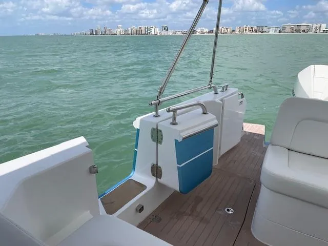 Slide: The Image of 2023 MJM 35z boat deck with ocean view and city skyline in background. - 23