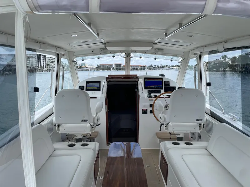 Slide: The Image of 2023 MJM 35z boat interior with helm, seating, and navigation equipment. - 7