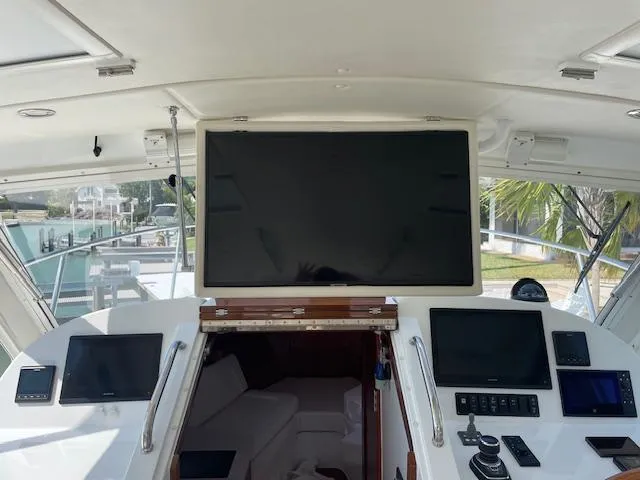 Slide: The Image of Interior view of 2023 MJM 35z yacht cockpit with navigation screens and controls. - 8