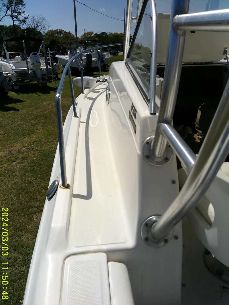 Slide: The Image of 2013 Sea Fox 236 Voyager boat deck with stainless steel railings, viewed from the side. - 17