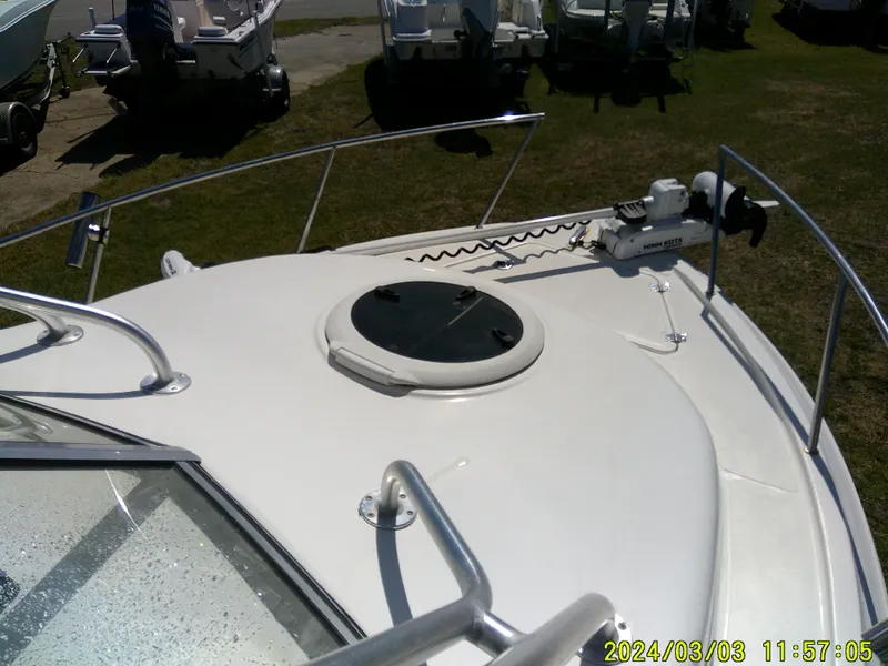 Slide: The Image of 2013 Sea Fox 236 Voyager boat deck with hatch and railing, photographed outdoors. - 21