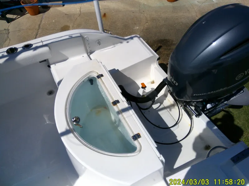 Slide: The Image of 2013 Sea Fox 236 Voyager boat with Yamaha outboard motor and livewell. - 29