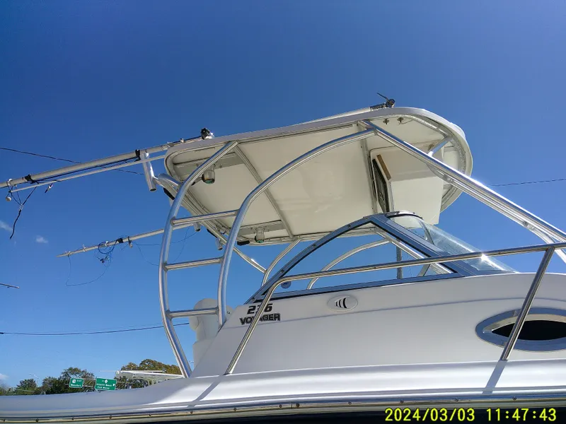 Slide: The Image of Sea Fox 236 Voyager boat, 2013 model, under clear blue sky. - 6