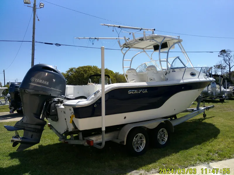 Slide: The Image of 2013 Sea Fox 236 Voyager boat on trailer with Yamaha outboard motor. - 7