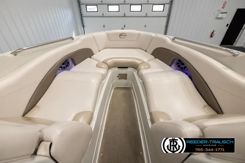 Slide: The Image of 2014 Crownline 255 SS boat interior with beige seating and modern design. - 14