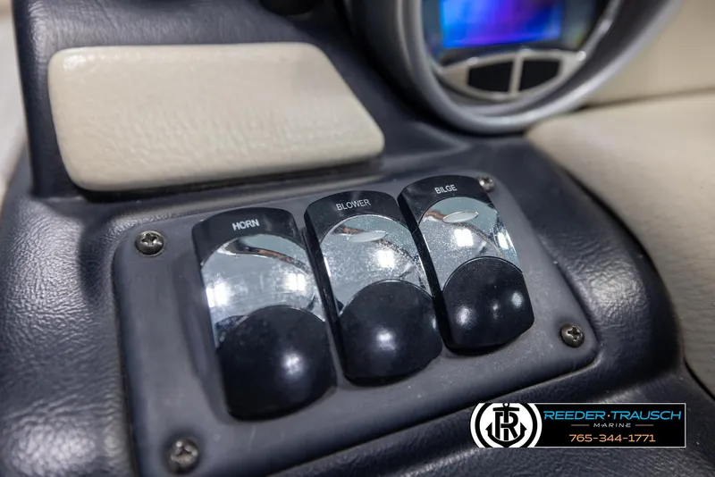 Slide: The Image of Control panel of a 2014 Crownline 255 SS boat with horn, blower, bilge switches. - 27