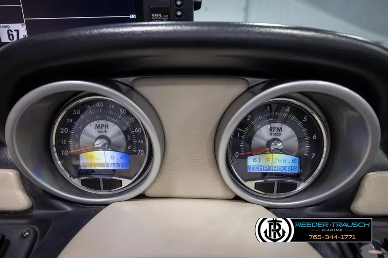 Slide: The Image of Dashboard of a 2014 Crownline 255 SS boat showing speedometer and RPM gauges. - 29