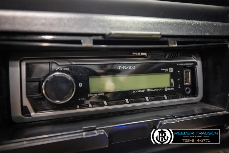 Slide: The Image of Kenwood stereo system in 2014 Crownline 255 SS boat dashboard. - 34