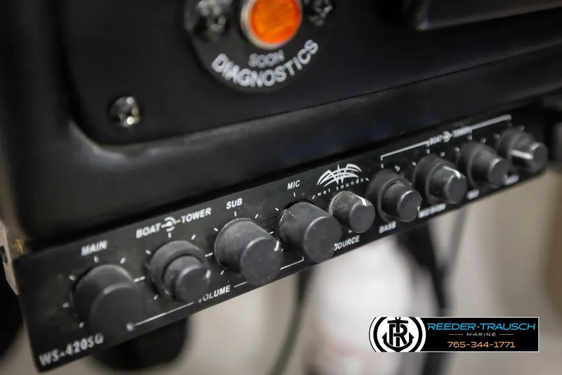 Slide: The Image of Audio control panel on a 2014 Crownline 255 SS boat, featuring various volume knobs. - 35