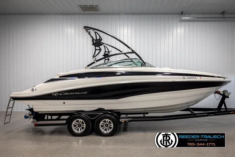 Slide: The Image of 2014 Crownline 255 SS boat on trailer in indoor showroom. - 4