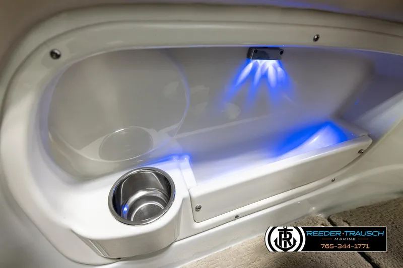 Slide: The Image of Interior of 2014 Crownline 255 SS boat with blue LED lighting and cup holder. - 42