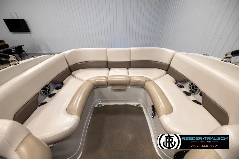 Slide: The Image of 2014 Crownline 255 SS boat interior with beige seating and modern design. - 43