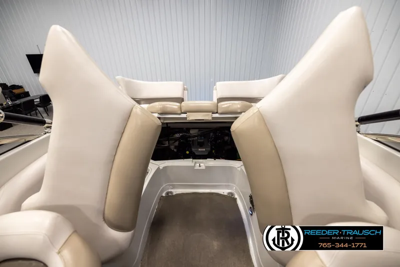 Slide: The Image of 2014 Crownline 255 SS boat interior with beige seating and storage area. - 44