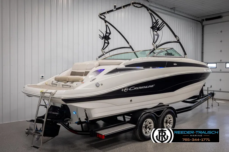 Slide: The Image of 2014 Crownline 255 SS boat on trailer in indoor showroom. - 5