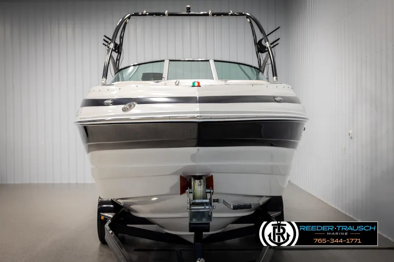 Slide: The Image of 2014 Crownline 255 SS boat on trailer in indoor storage facility. - 7