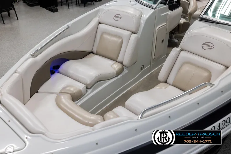 Slide: The Image of 2014 Crownline 255 SS boat interior with beige seating and sleek design. - 9