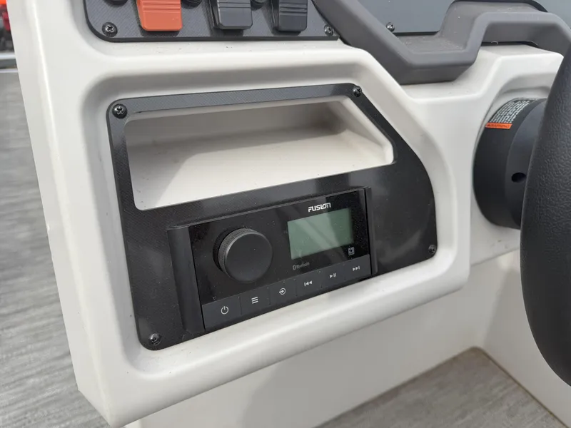 Slide: The Image of Control panel of 2022 Godfrey Sweetwater 1886 FX boat with audio system. - 14