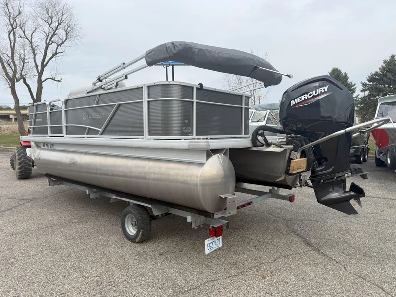 Slide: The Image of 2022 Godfrey Sweetwater 1886 FX pontoon boat with Mercury outboard motor on trailer. - 5