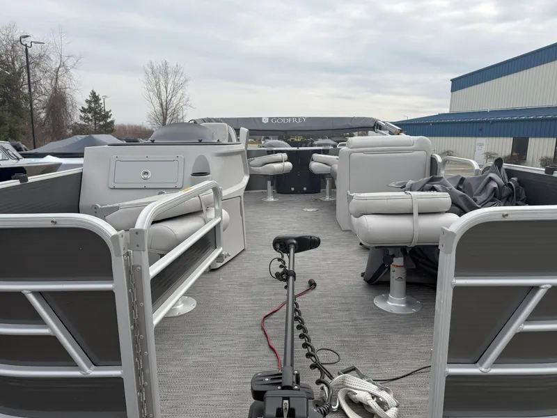 Slide: The Image of 2022 Godfrey Sweetwater 1886 FX pontoon boat with spacious seating and modern design. - 6