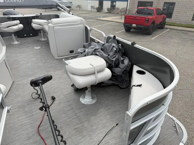 Slide: The Image of 2022 Godfrey Sweetwater 1886 FX pontoon boat interior with seating and equipment. - 8