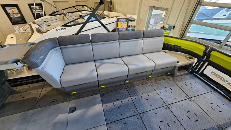 Slide: The Image of 2023 Sea-Doo Switch Cruise 21 interior with spacious seating in a showroom. - 10
