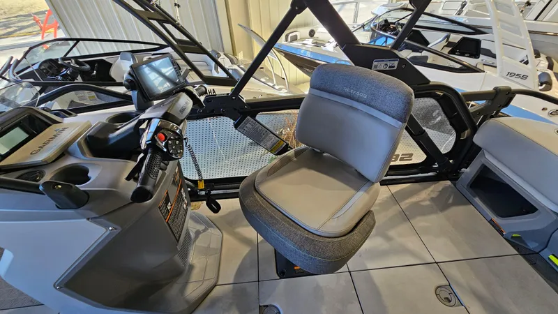 Slide: The Image of 2023 Sea-Doo Switch Cruise 21 interior with steering console and seating. - 12