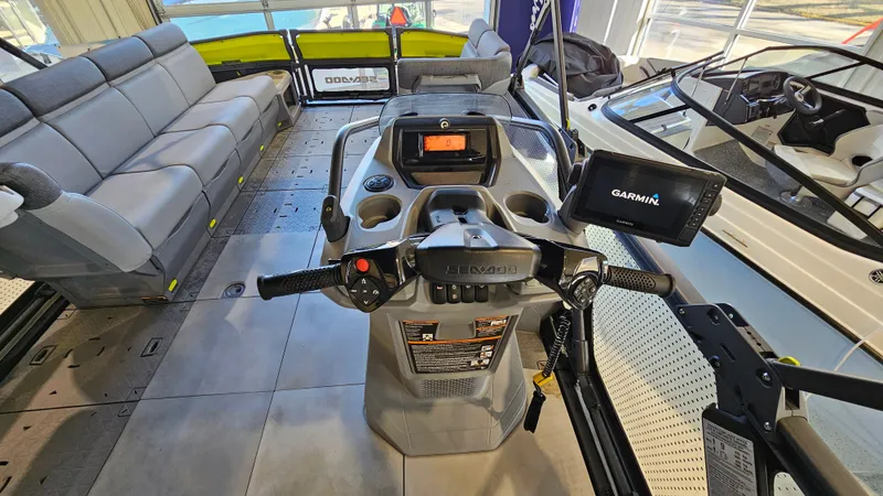 Slide: The Image of 2023 Sea-Doo Switch Cruise 21 interior with steering console and seating. - 14