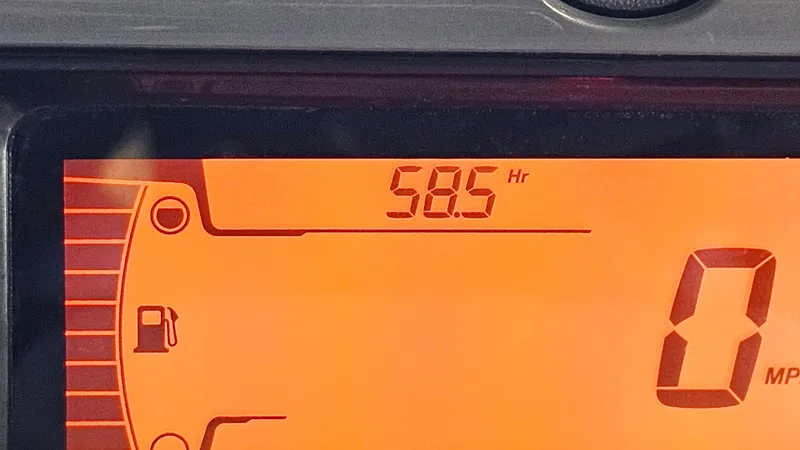 Slide: The Image of Dashboard display of 2023 Sea-Doo Switch Cruise 21 showing 58.5 hours and fuel gauge. - 18