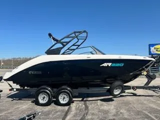 Slide: The Image of 2025 Yamaha AR220 boat on trailer, sleek design, black and white exterior. - 0