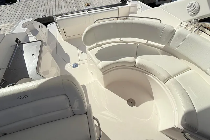 Slide: The Image of 2007 Regal Commodore 3760 IB boat interior with white seating and deck. - 10