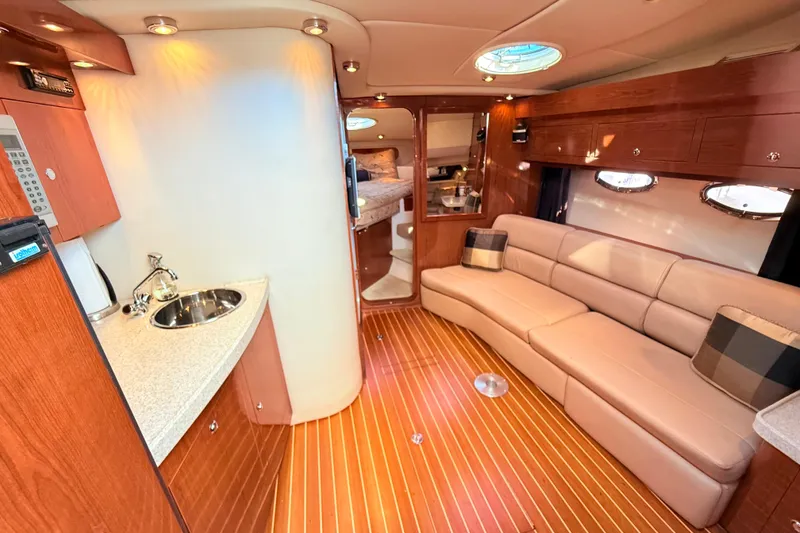 Slide: The Image of Luxurious interior of 2007 Regal Commodore 3760 IB yacht with plush seating and kitchenette. - 11