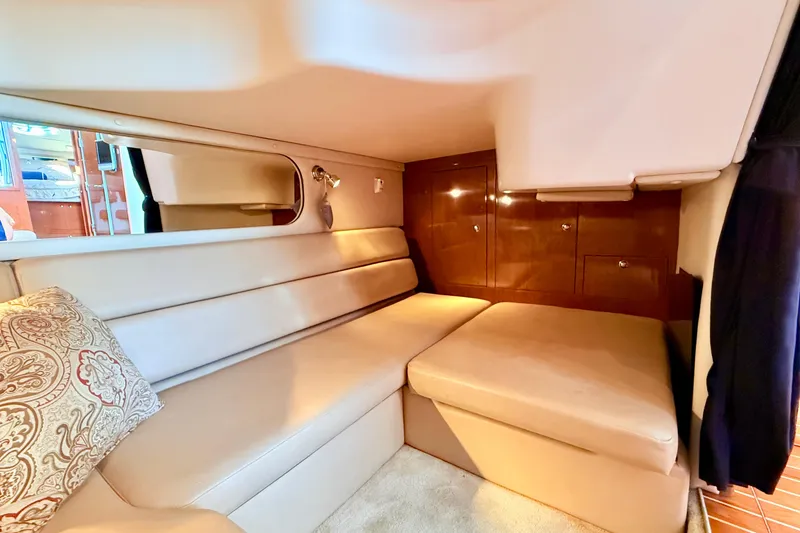 Slide: The Image of 2007 Regal Commodore 3760 IB interior with beige seating and wooden cabinetry. - 16