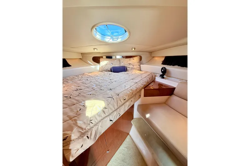 Slide: The Image of Luxurious cabin interior of 2007 Regal Commodore 3760 IB yacht with cozy bed and seating. - 17