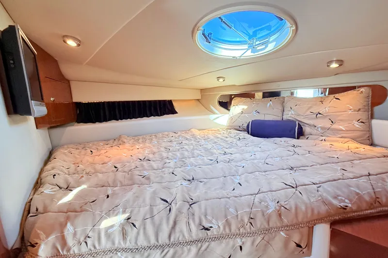 Slide: The Image of Luxurious cabin interior of 2007 Regal Commodore 3760 IB yacht with cozy bedding. - 18
