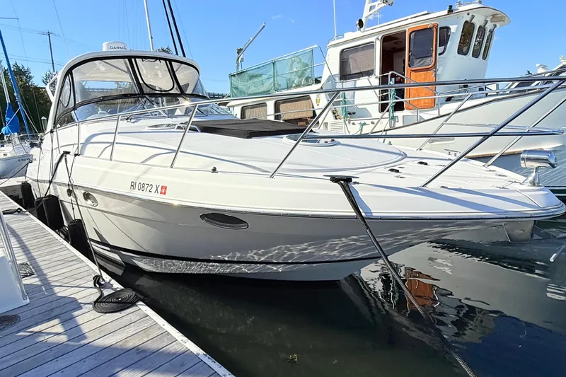 Slide: The Image of 2007 Regal Commodore 3760 IB yacht docked at marina, side view. - 2