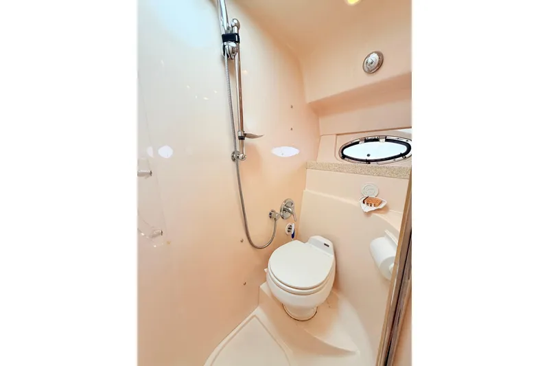 Slide: The Image of Bathroom interior of 2007 Regal Commodore 3760 IB yacht, featuring shower and toilet. - 22