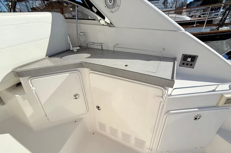 Slide: The Image of 2007 Regal Commodore 3760 IB boat kitchenette with sink and storage cabinets. - 6