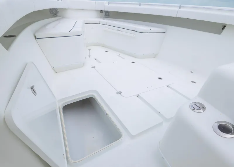 Slide: The Image of 2011 Yellowfin 42 Offshore boat interior with storage compartments and seating. - 11