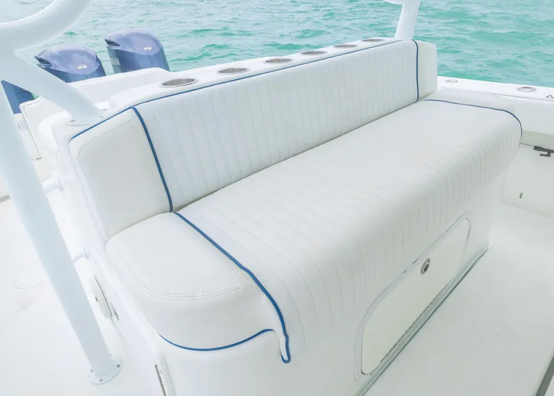 Slide: The Image of White cushioned seating on 2011 Yellowfin 42 Offshore boat, with ocean backdrop. - 13