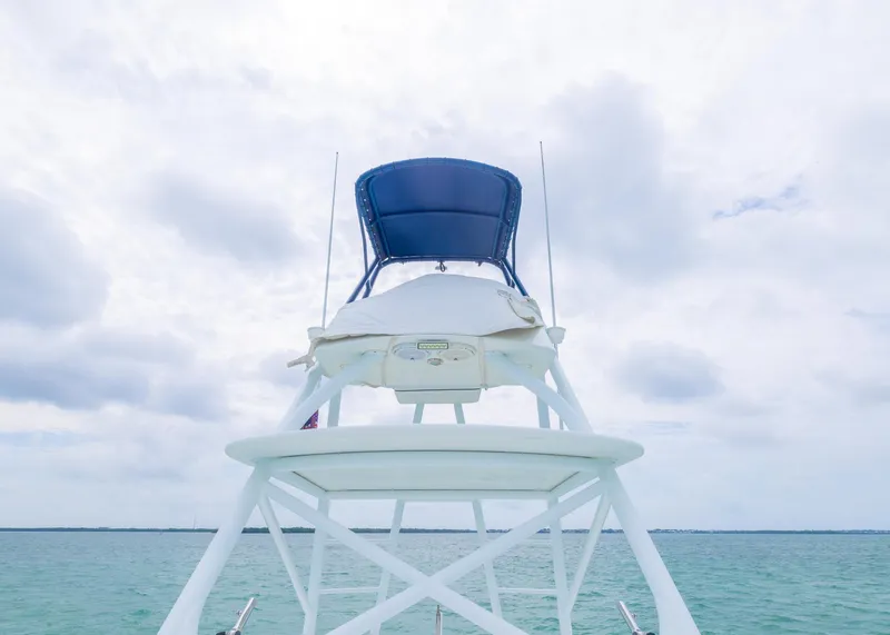 Slide: The Image of 2011 Yellowfin 42 Offshore boat tower against cloudy sky and ocean backdrop. - 18