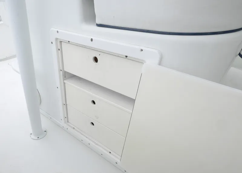 Slide: The Image of Storage drawers on a 2011 Yellowfin 42 Offshore boat, featuring a sleek white design. - 22