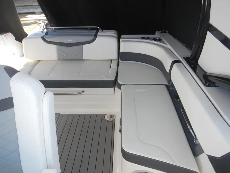 Slide: The Image of 2023 Chaparral 280 OSX boat interior with sleek white and gray seating. - 9