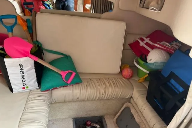 Slide: The Image of Interior of 2001 Sea Ray 340 Sundancer with beach gear and colorful accessories. - 11