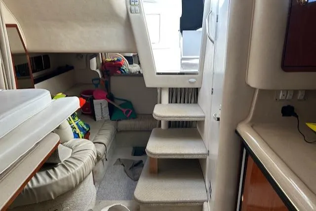 Slide: The Image of Interior of 2001 Sea Ray 340 Sundancer boat with seating and stairs. - 9