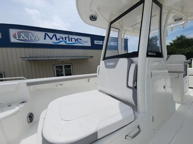 Slide: The Image of 2025 Parker 2600 CC boat at I&M Marine dealership, showcasing sleek design and seating. - 19